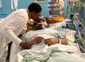Mum Wumi kisses Damilola Olakanmi goodbye in hospital, after she fell ill from eating what she thought was a cannabis sweet. Credit: Family handout