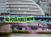 Extinction Rebellion drop huge banner off Tower Bridge on eve of Rebellion in London