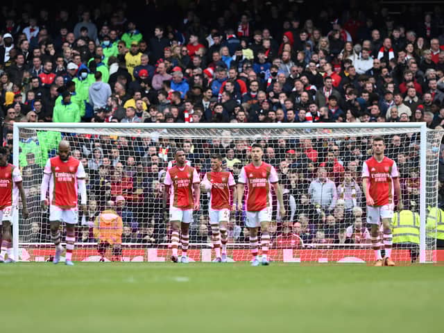 Arsenal players react after conceding a second goal  during the English Premier League football match  (Photo by JUSTIN TALLIS/AFP via Getty Images)