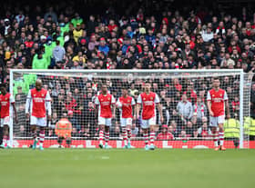 Arsenal players react after conceding a second goal  during the English Premier League football match  (Photo by JUSTIN TALLIS/AFP via Getty Images)