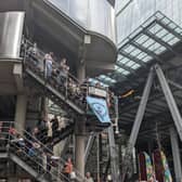 Extinction Rebellion activists hung a blue banner on the side of the Lloyd’s building saying “End Fossil Fuels Now” and drummed on the steps.