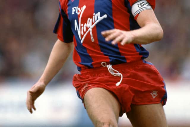 Crystal Palace legend Geoff Thomas playing for the club in 1990. Credit: Ben Radford/Allsport/Getty Images/Hulton Archive