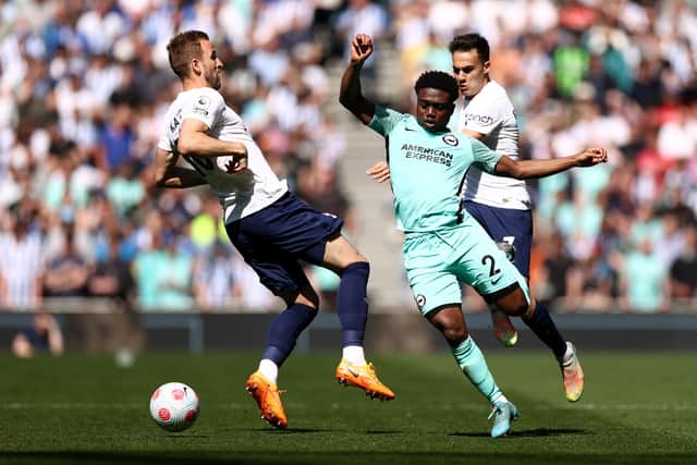  Tariq Lamptey of Brighton & Hove Albion is challenged by Harry Kane of Tottenham Hotspur during the Premier League match between (Photo by Ryan Pierse/Getty Images)