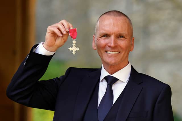 Geoff Thomas receiving his MBE in March. Credit: Steve Parsons - WPA Pool/Getty Images