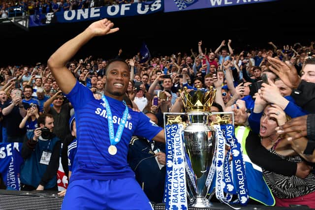  Didier Drogba of Chelsea celebrates with fans and the trophy  after the Barclays Premier League match (Photo by Mike Hewitt/Getty Images)