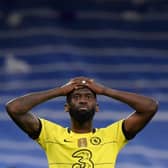Chelsea's German defender Antonio Ruediger reacts at the end of the UEFA Champions League quarter final (Photo by OSCAR DEL POZO/AFP via Getty Images)