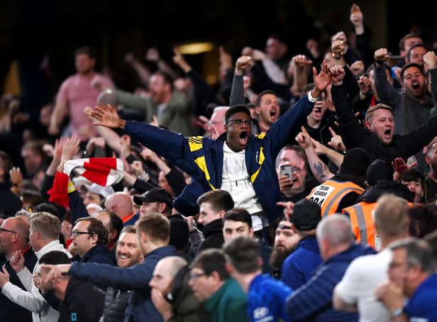 <p>Arsenal fans celebrate their sides second goal during the Premier League match Photo by Justin Setterfield/Getty Images)</p>