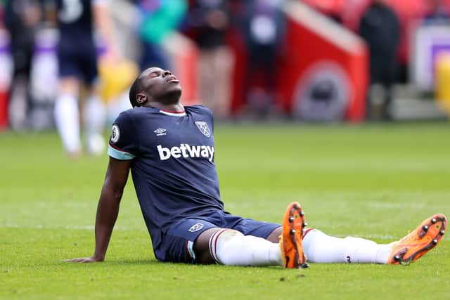 Kurt Zouma of West Ham United reacts as he appears to be injured during the Premier League match (Photo by Warren Little/Getty Images)