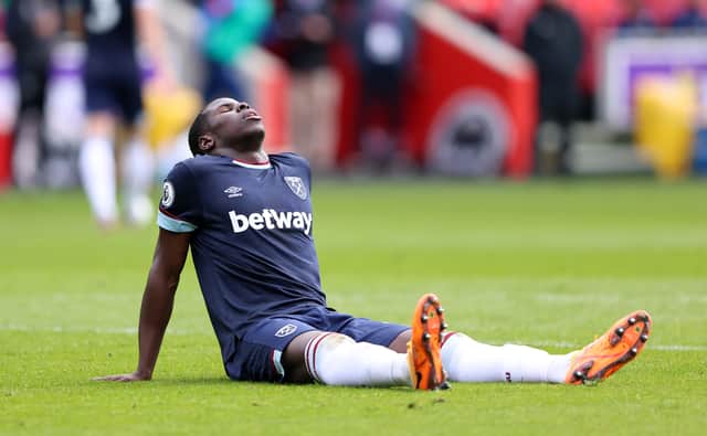 Kurt Zouma of West Ham United reacts as he appears to be injured during the Premier League match (Photo by Warren Little/Getty Images)