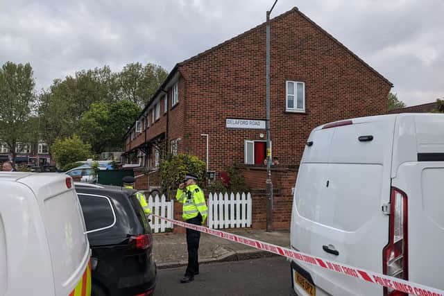 Officers at the police cordon in Delaford Road, South Bermondsey, where four people were killed in the early hours of this morning. Credit: Lynn Rusk