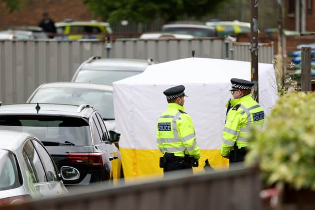 Police officers stand on patrol outside a home where three women and a man were found stabbed to death on April 25, 2022 in the Bermondsey area of London, England. The Met Police said a man was in custody at a south London police station on suspicion of murder. (Photo by Hollie Adams/Getty Images)