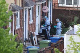 Forensic officers attend the scene where three women and a man were found stabbed to death on April 25, 2022 in the Bermondsey area of London. Credit: Hollie Adams/Getty Images