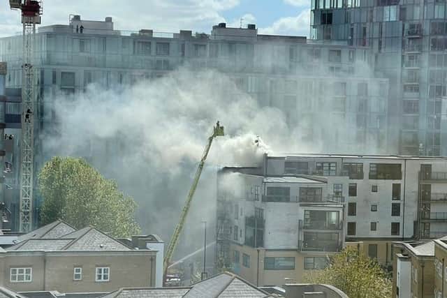 Firefighters are tackling an “intense fire” on the roof of a block of flats in Deptford. Photo: Marilyn DiCara