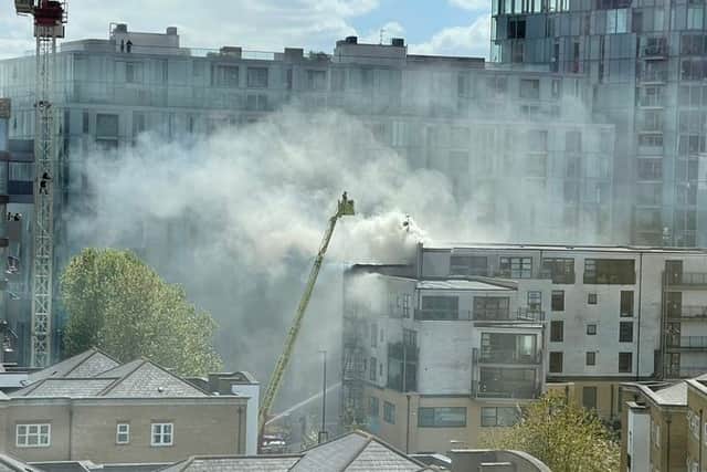 Firefighters are tackling an “intense fire” on the roof of a block of flats in Deptford. Photo: Marilyn DiCara
