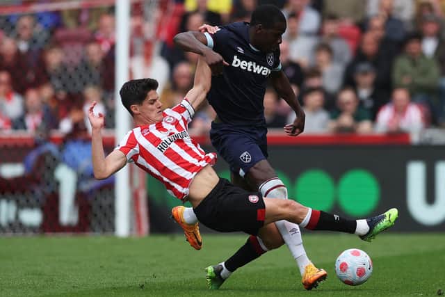 Kurt Zouma of West Ham United is challenged by Christian Norgaard of Brentford. (Photo by Eddie Keogh/Getty Images)