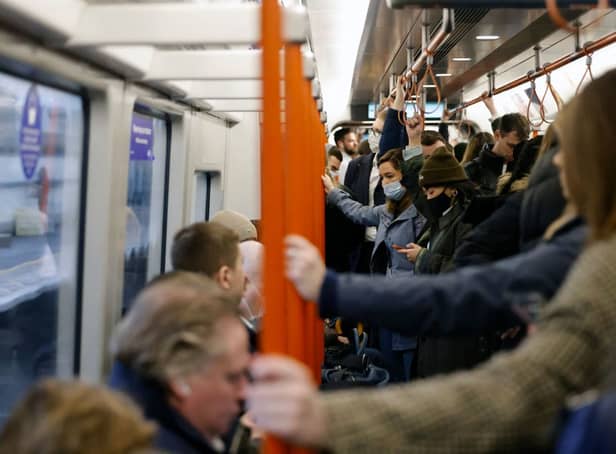 <p>Commuters on the London Overground. Credit: TOLGA AKMEN/AFP via Getty Images</p>
