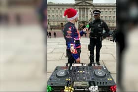 Video grab of Zachary Sabri, who goes by the DJ name ‘SUAT’, being confronted by police outside Buckingham Palace. Credit:  Zachary Sabri / SWNS