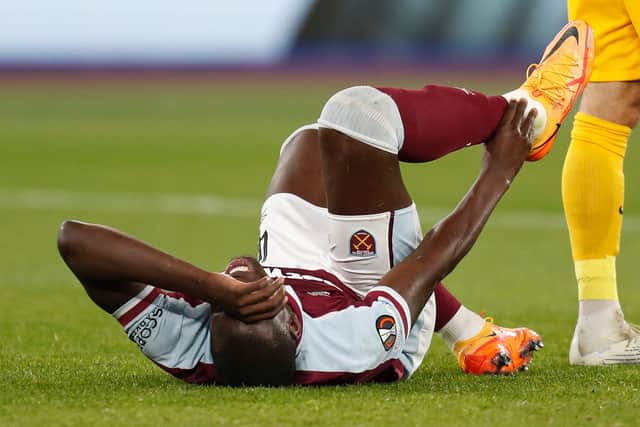 Kurt Zouma holds his ankle during the UEFA Europa League semi-final first leg (Photo by Ian Kington / IKIMAGES / AFP) (Photo by IAN KINGTON/IKIMAGES/AFP via Getty Images)