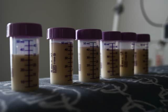 Stock image of bottles of expressed breast milk are seen on top of the incubator of a premature baby. Photo: Getty