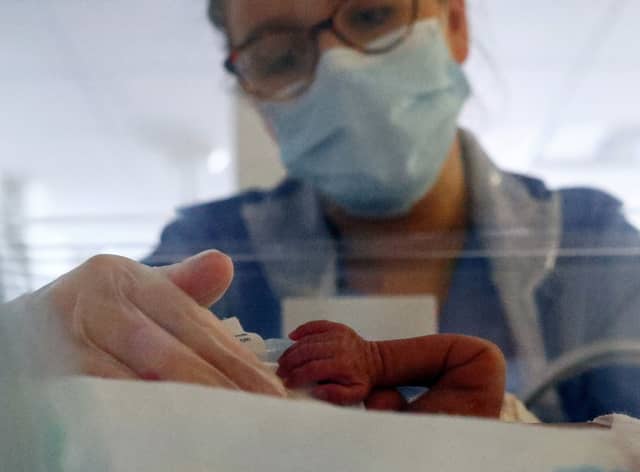 Stock image of a neonatal nurse caring for a premature baby in an incubator in hospital. Photo: Getty