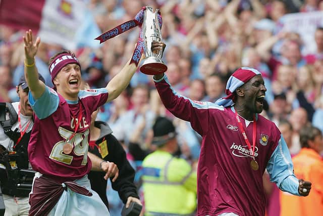 Mark Noble and Chris Powell of West Ham celebrate promotion after the play-off final in 2005. Credit: Mike Hewitt/Getty Images