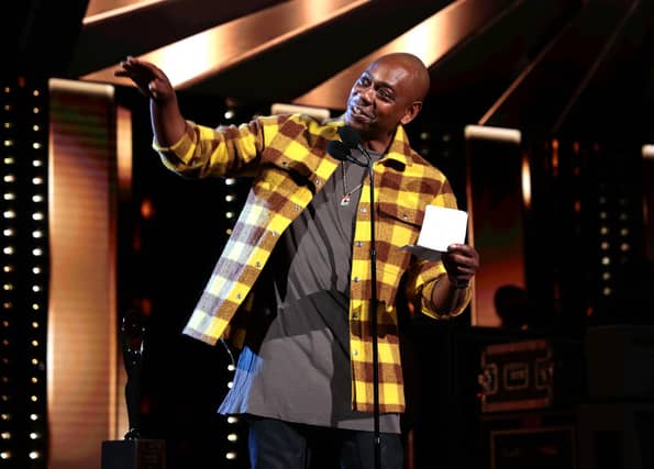 Dave Chappelle speaks onstage during the 36th Annual Rock & Roll Hall Of Fame Induction Ceremony at Rocket Mortgage Fieldhouse on October 30, 2021 in Cleveland, Ohio (Photo by Dimitrios Kambouris/Getty Images for The Rock and Roll Hall of Fame )