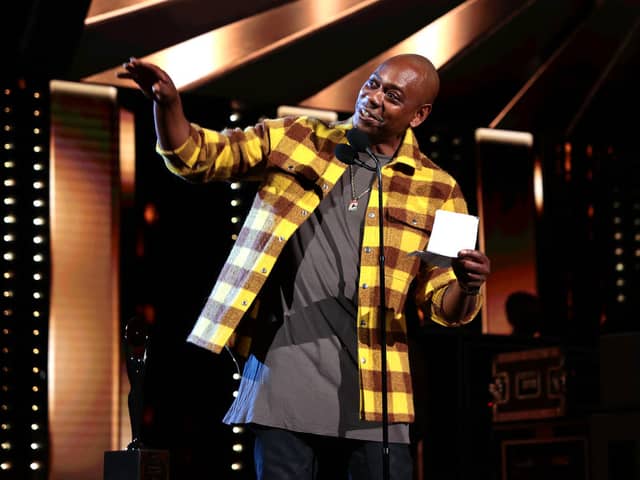  Dave Chappelle speaks onstage during the 36th Annual Rock & Roll Hall Of Fame Induction Ceremony at Rocket Mortgage Fieldhouse on October 30, 2021 in Cleveland, Ohio (Photo by Dimitrios Kambouris/Getty Images for The Rock and Roll Hall of Fame )