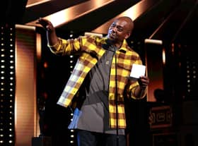  Dave Chappelle speaks onstage during the 36th Annual Rock & Roll Hall Of Fame Induction Ceremony at Rocket Mortgage Fieldhouse on October 30, 2021 in Cleveland, Ohio (Photo by Dimitrios Kambouris/Getty Images for The Rock and Roll Hall of Fame )