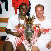 Patrick Vieira and Dennis Bergkamp of Arsenal with the Premier League Trophy (Photo by Stuart MacFarlane/Arsenal FC via Getty Images)