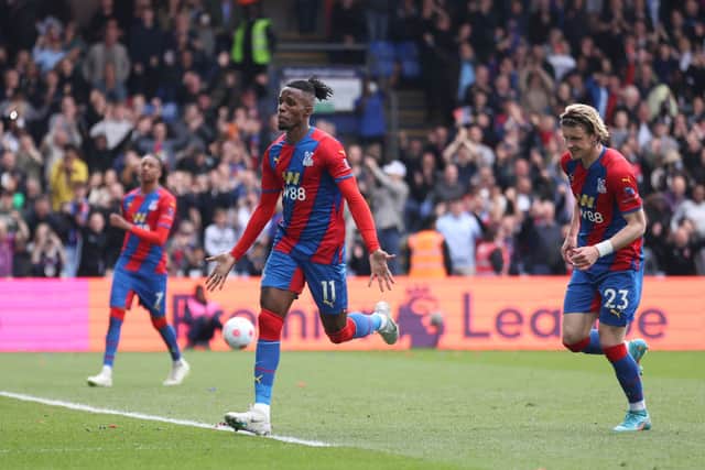 Wilfried Zaha of Crystal Palace celebrates after scoring their team’s first goal from the penalty spot during the Premier League match between Crystal Palace and Watford at Selhurst Park. Credit: Warren Little/Getty Images