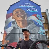Olympic medallist Kye Whyte in front of his new mural in Peckham. Credit: Gymshark