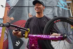Olympic medallist Kye Whyte in front of his new mural in Peckham. Credit: Gymshark