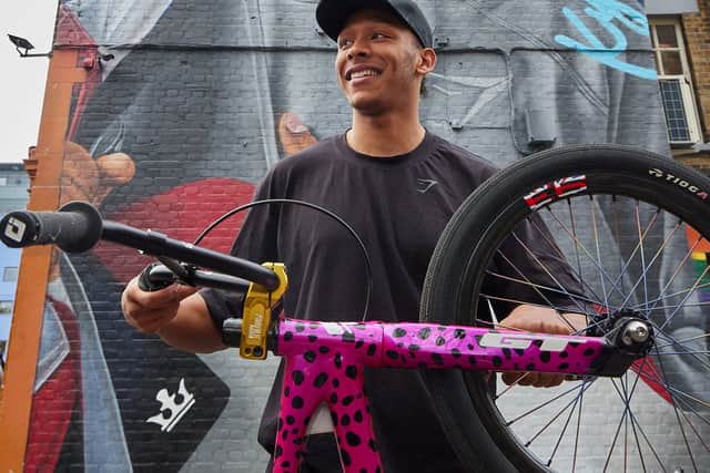 Olympic medallist Kye Whyte in front of his new mural in Peckham. Credit: Gymshark