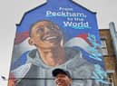 Olympic medallist Kye Whyte in front of his new mural in Peckham. Credit: Gymshark