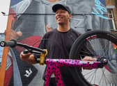 Olympic medallist Kye Whyte in front of his new mural in Peckham. Credit: Gymshark