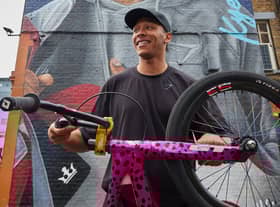Olympic medallist Kye Whyte in front of his new mural in Peckham. Credit: Gymshark