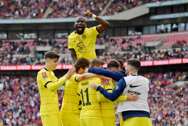 Mason Mount of Chelsea (obscured) celebrates with teammates after scoring their team’s second (Photo by Mike Hewitt/Getty Images)