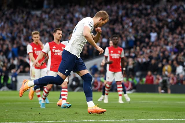 Harry Kane of Tottenham Hotspur celebrates after scoring their side's first goal during the Premier League (Photo by Mike Hewitt/Getty Images)