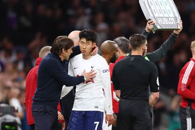 Heung-Min Son of Tottenham Hotspur reacts with Antonio Conte, Manager of Tottenham Hotspur after being substituted. Credit: Clive Rose/Getty Images