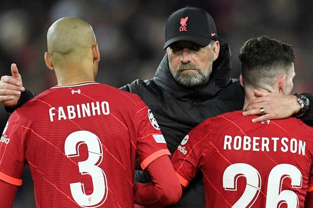 Liverpool manager Jurgen Klopp with Fabinho and Andy Robertson. Picture: OLI SCARFF/AFP via Getty Images