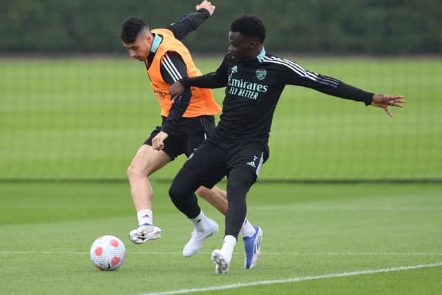 Bukayo Saka and Gabriel Martinelli tussle in training. Credit: Stuart MacFarlane/Arsenal FC via Getty Images