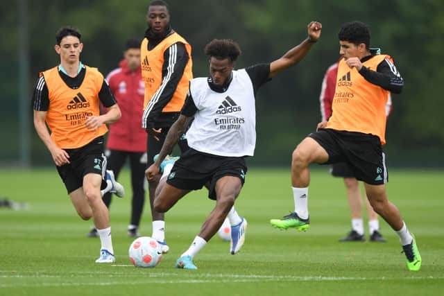 Youngsters Charlie Patino and Salah-Eddine take on Nuno Tavares, centre, in Arsenal training. Credit: Stuart MacFarlane/Arsenal FC via Getty Images