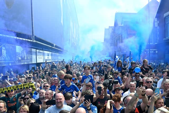 Everton fans wait to greet the team bus ahead of the Premier League match  (Photo by Gareth Copley/Getty Images)