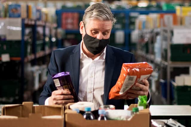 Sir Keir Starmer visiting a food bank during the pandemic. Photo: Getty