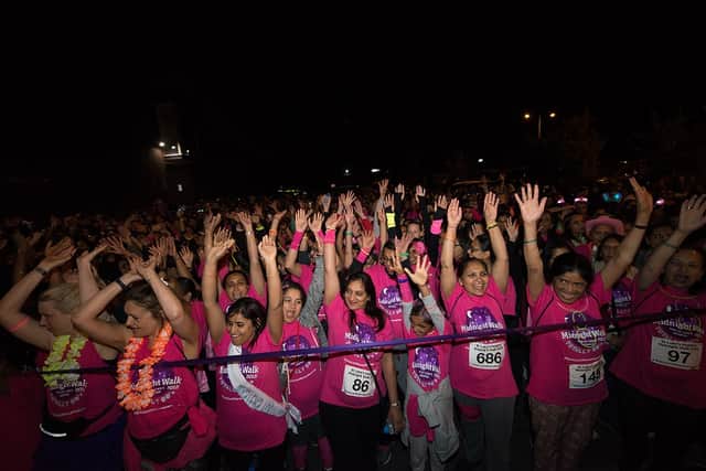 Hundreds of people join together in their free pink t-shirts as they take part in last year’s Midnight Walk to raise money for St Luke’s Hospice (Credit: St Luke’s Hospice)