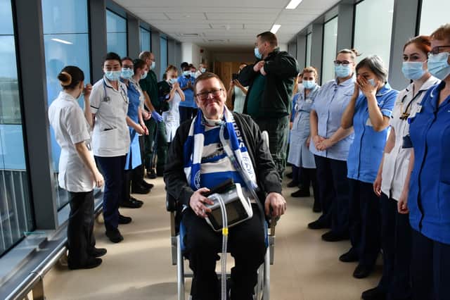 Tearful NHS staff applauding 66-year-old Steve Carr as he gets ready to leave the hospital (Credit: NHS England)