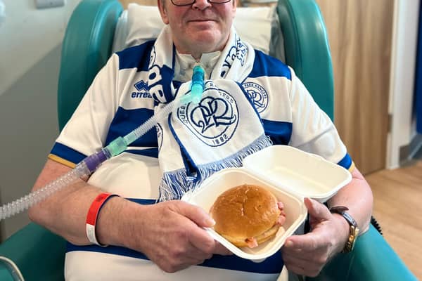 Steve Carr, a QPR fan with motor neurone disease, ready to eat his first bacon roll in months (Credit: NHS England) 