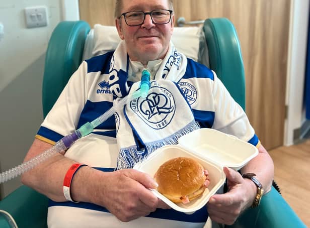 <p>Steve Carr, a QPR fan with motor neurone disease, ready to eat his first bacon roll in months (Credit: NHS England) </p>