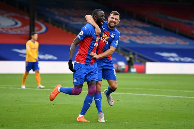 Cheikhou Kouyate of Crystal Palace celebrates with teammate James McArthur (Photo by Justin Setterfield/Getty Images)