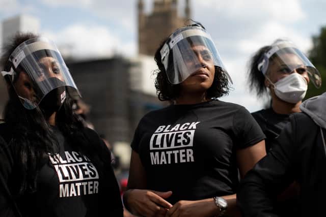 Protestors in Black Lives Matter T-shirts. Photo: Getty